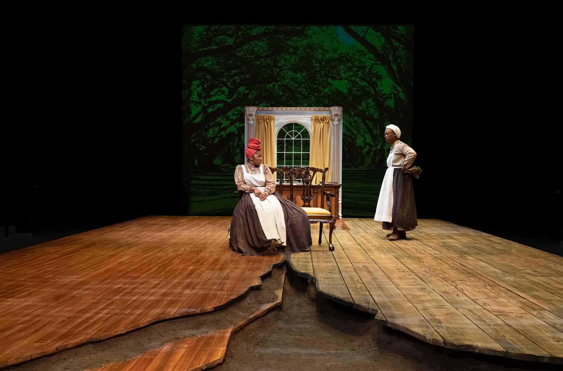 One person sitting next to a person standing.