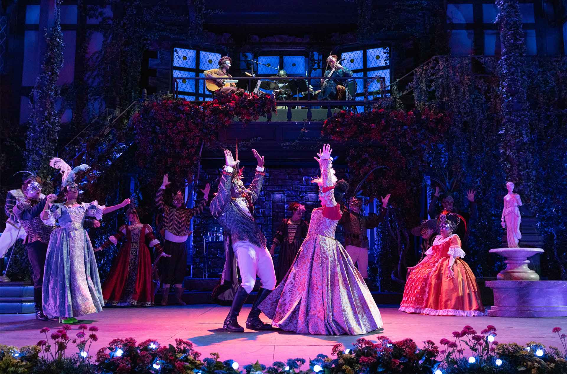 A group of people dancing at a ball.