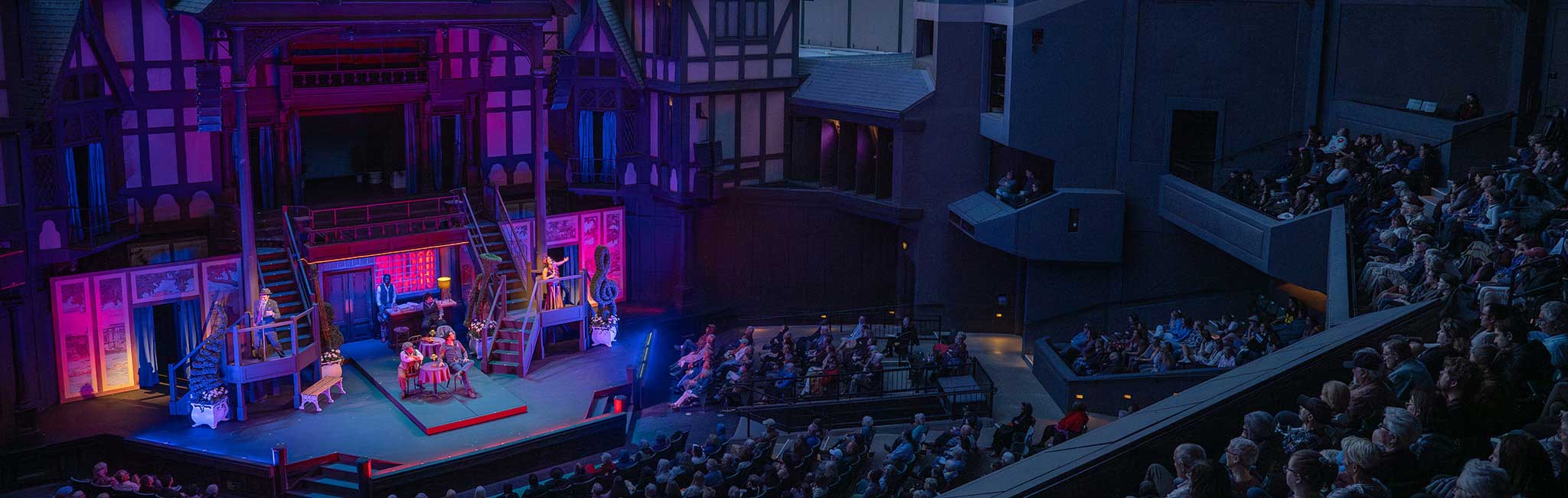 A wide shot of the Allen Elizabethan stage showing the audience watching a play.