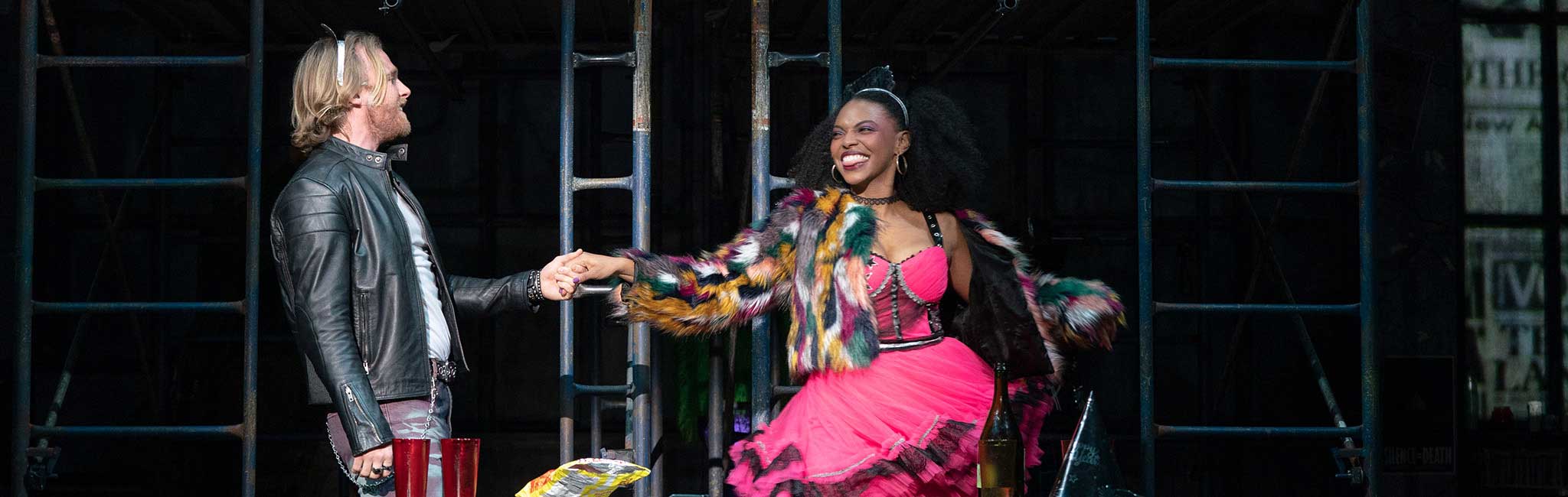 Two people hand in hand dancing.