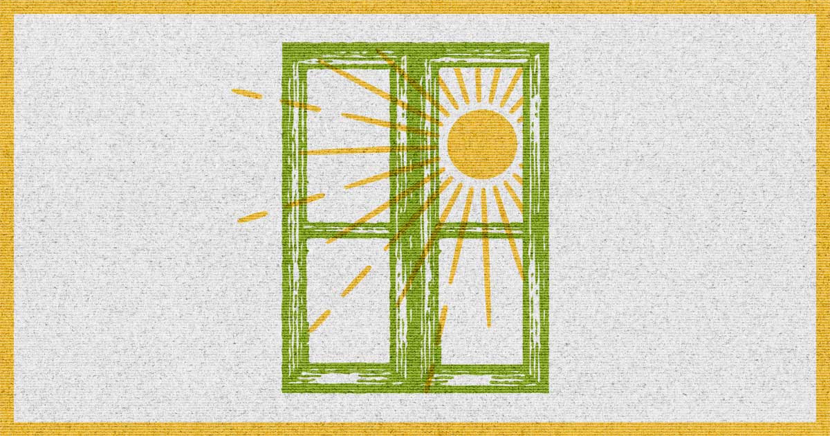 A green window frame with golden sunlight shining through the glass panes.